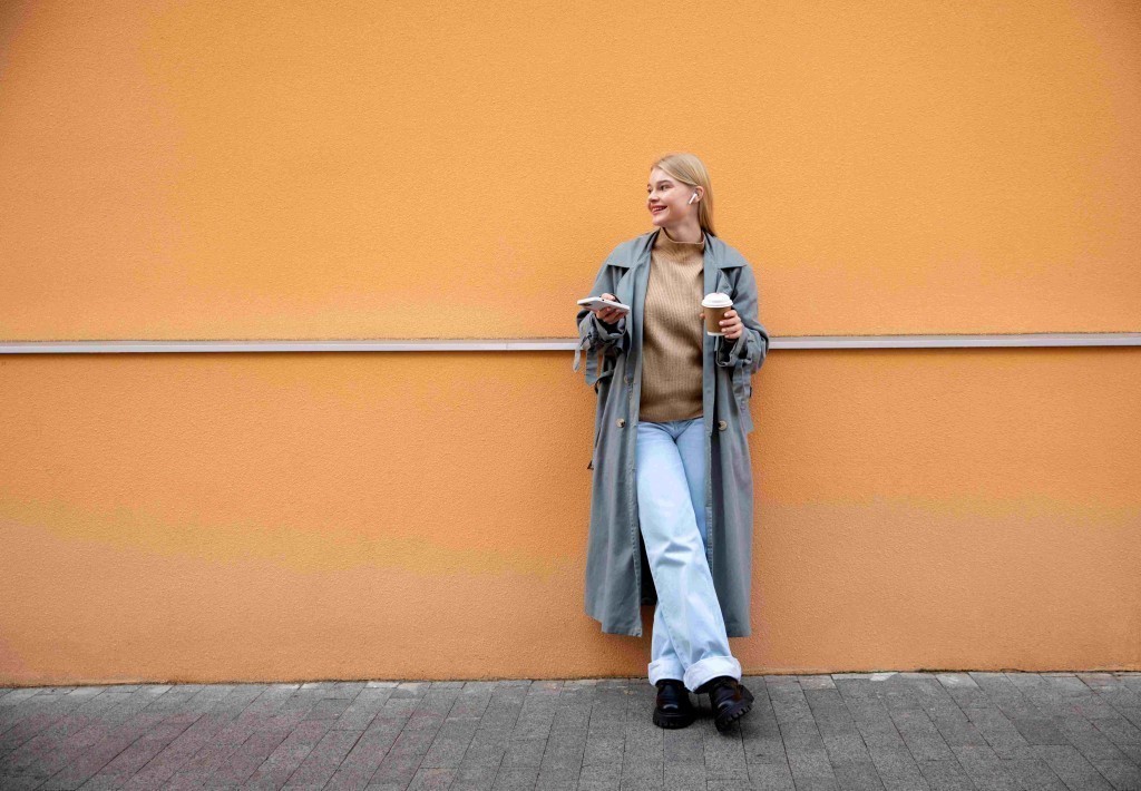 full-shot-woman-with-phone-coffee-cup.jpg